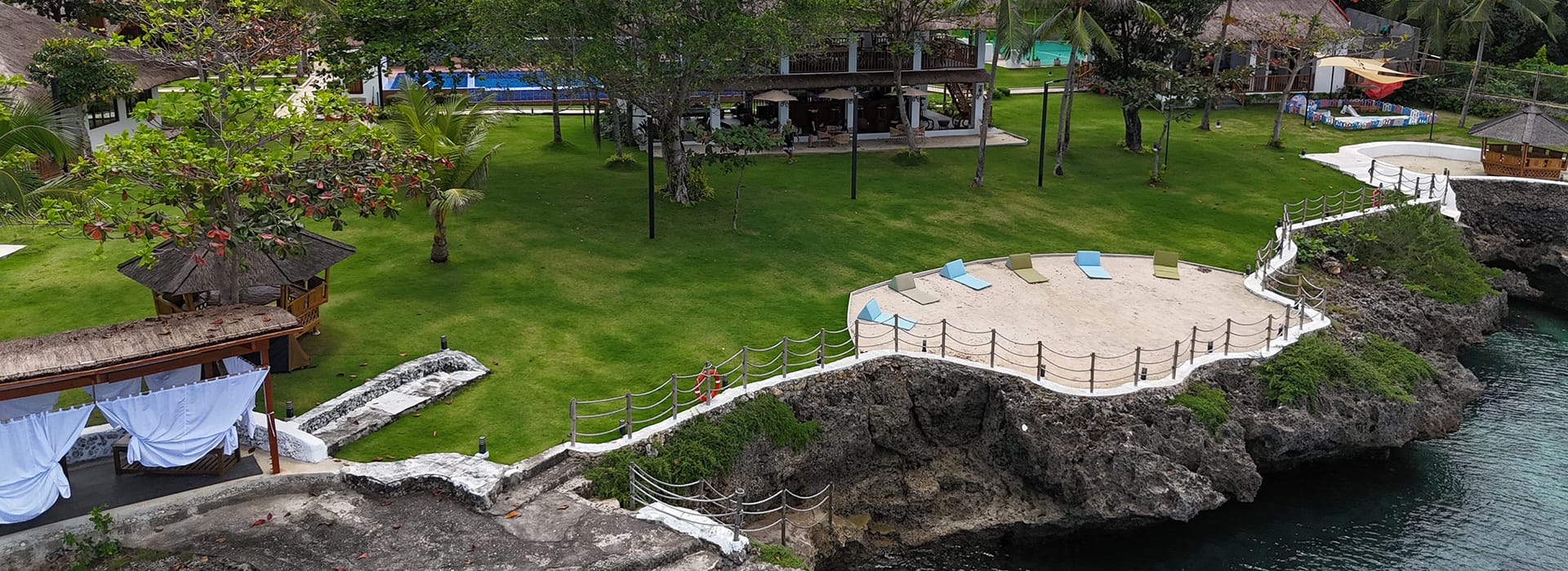 Aerial view of Casa Verde Cliff Resort on the coastline of Camotes Island